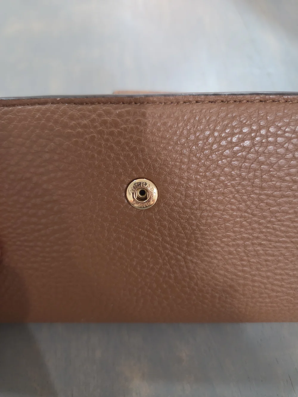 Michael Kors Brown Pebbled Leather Wallet-Style Phone Case with Gold MK Logo
